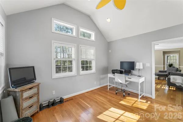 a workspace with furniture hardwood and a window