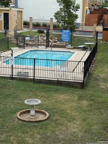 a view of a swimming pool with a garden