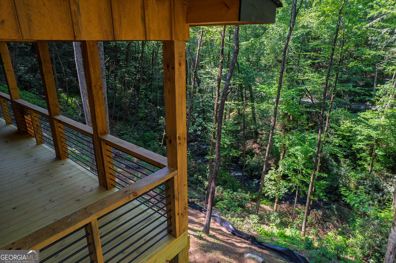 122 Laurel Creek Trail Blue Ridge, GA 30513 - Photo 14 of 18 a balcony with trees in front of it