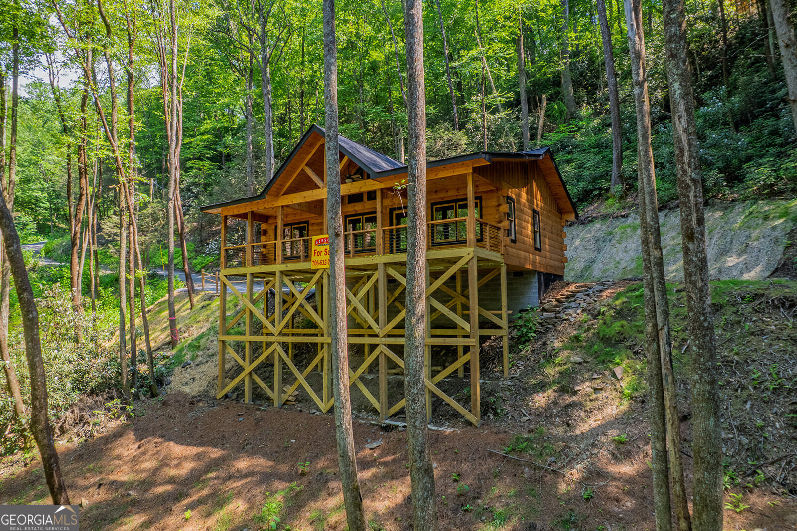 122 Laurel Creek Trail Blue Ridge, GA 30513 - Photo 5 of 18 a front view of a house with a yard