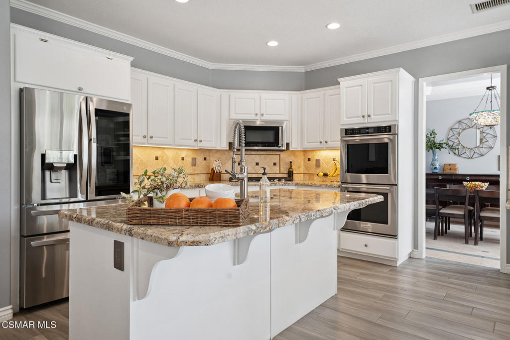 206 Shady Hills Court Simi Valley, CA 93065 - Photo 15 of 84 a kitchen with stainless steel appliances granite countertop a stove a sink and a refrigerator