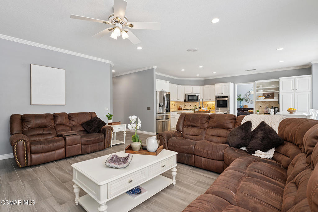 206 Shady Hills Court Simi Valley, CA 93065 - Photo 19 of 84 a living room with furniture a table and a chandelier
