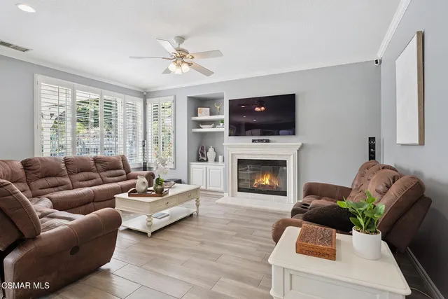a living room with furniture and a closet