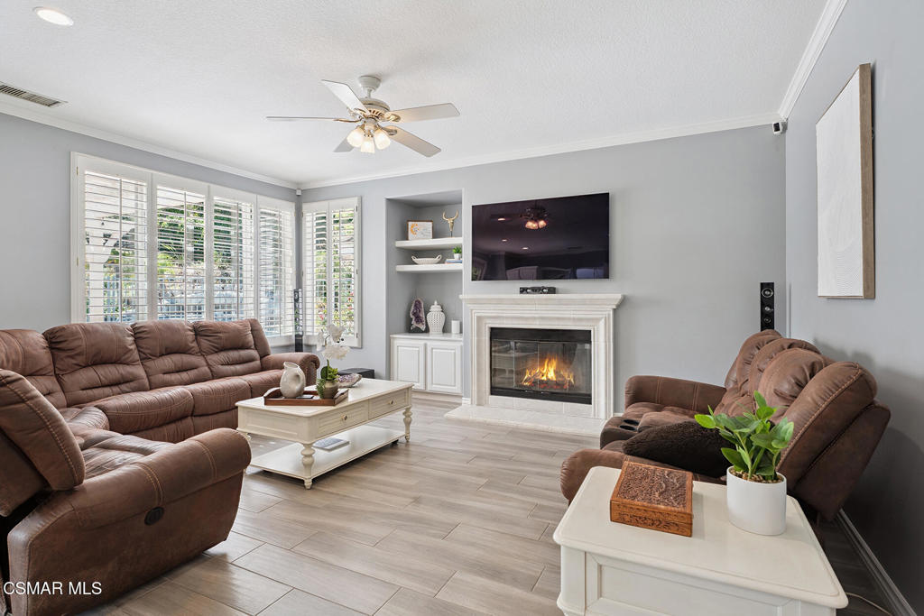 206 Shady Hills Court Simi Valley, CA 93065 - Photo 20 of 84 a living room with furniture a flat screen tv and a fireplace