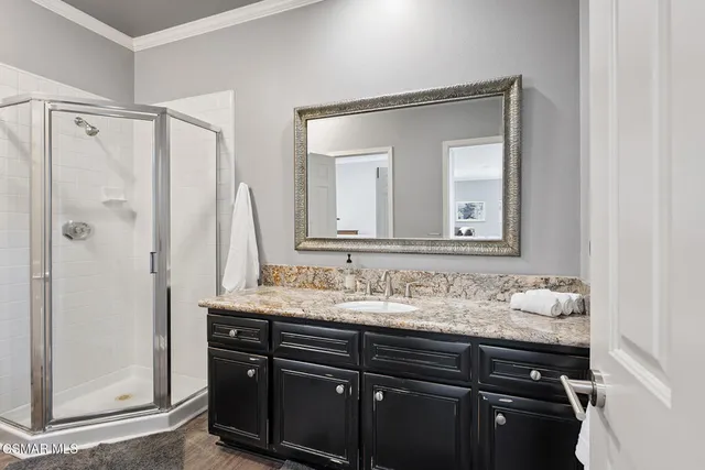 a bathroom with a sink a vanity and a mirror