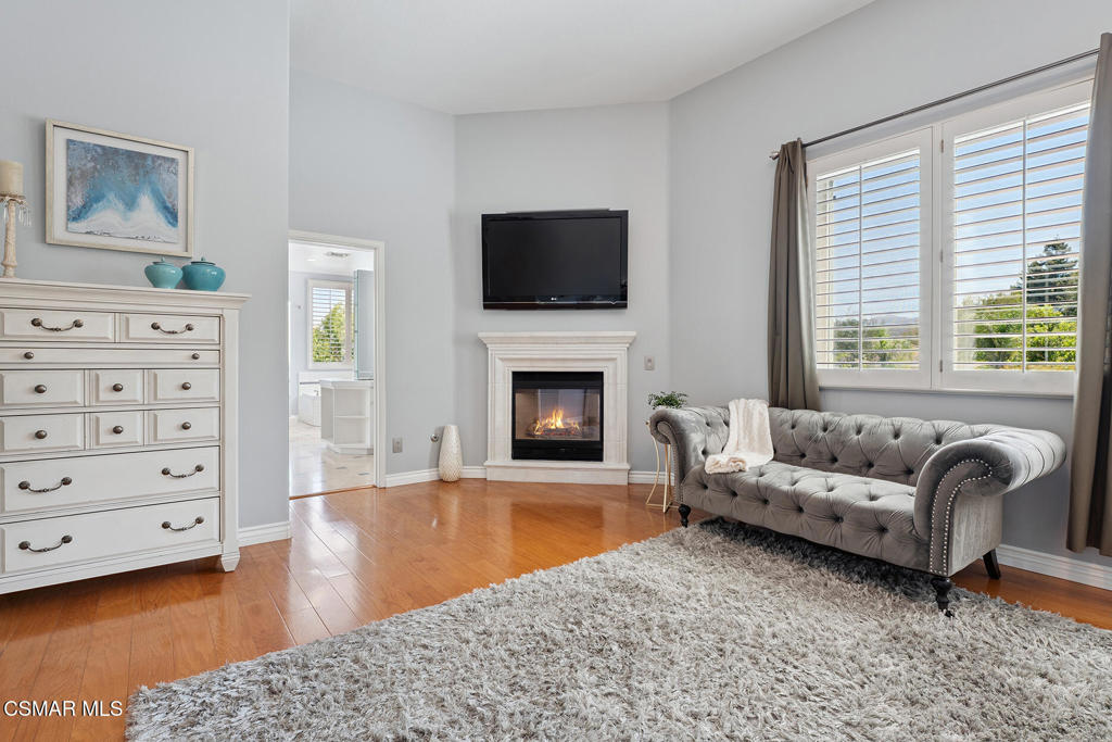 206 Shady Hills Court Simi Valley, CA 93065 - Photo 36 of 84 a living room with furniture a flat screen tv and a fireplace