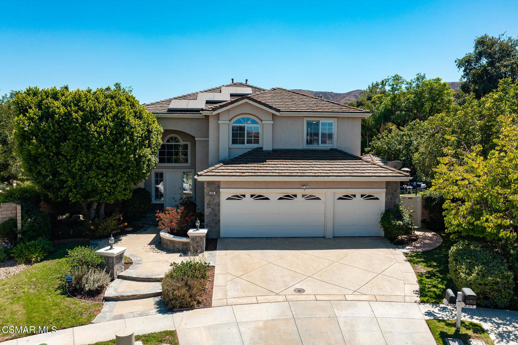 206 Shady Hills Court Simi Valley, CA 93065 - Photo 4 of 84 a front view of a house with a garden