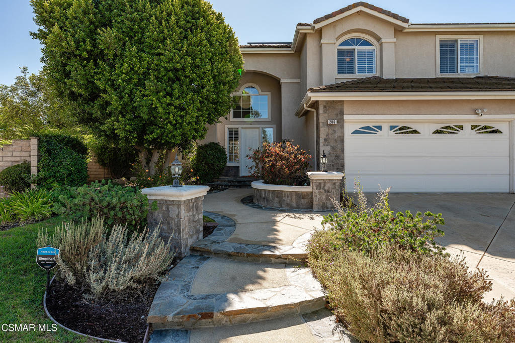 206 Shady Hills Court Simi Valley, CA 93065 - Photo 5 of 84 a view of a house with a yard and potted plants