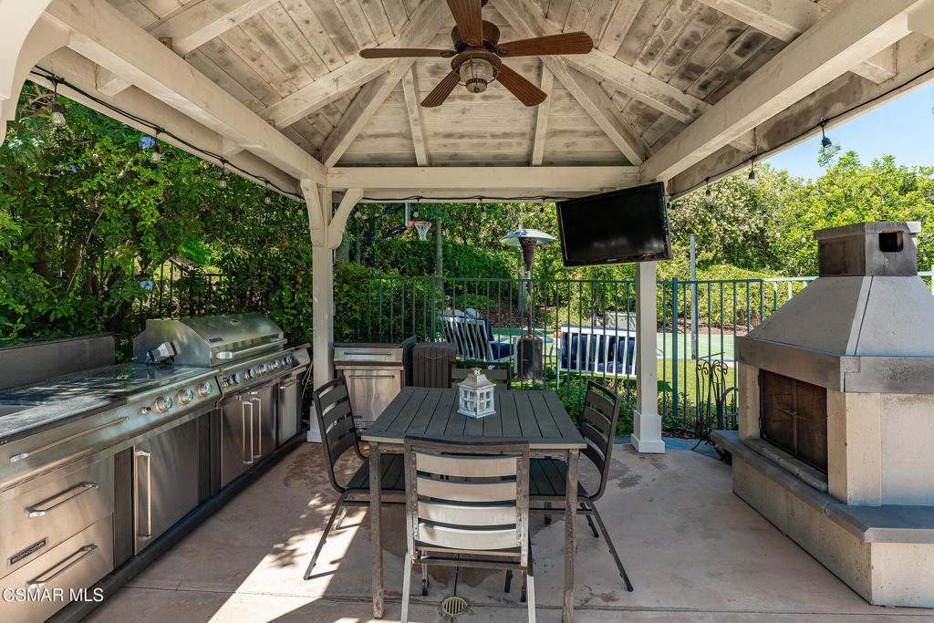 206 Shady Hills Court Simi Valley, CA 93065 - Photo 61 of 84 a view of a patio with table and chairs potted plants with wooden floor