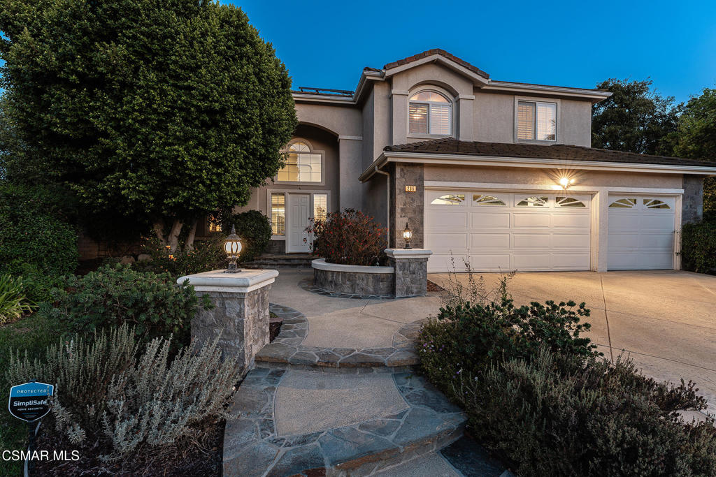 206 Shady Hills Court Simi Valley, CA 93065 - Photo 64 of 84 a front view of a house with a yard and garage
