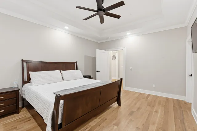 a bedroom with a bed and cabinet