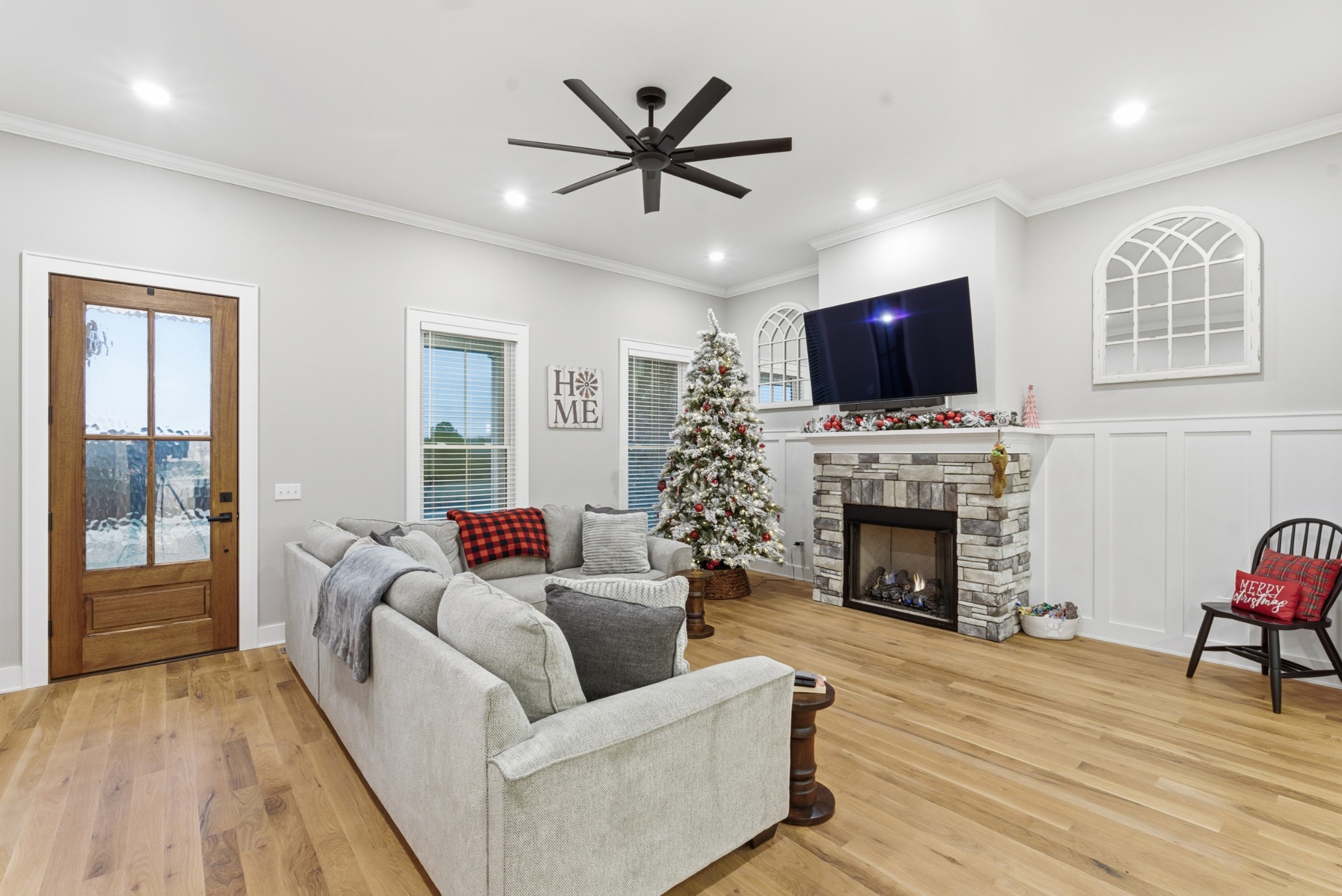 3055 Loren Lane Centerville, TN 37033 - Photo 6 of 40 a living room with furniture a fireplace and a flat screen tv
