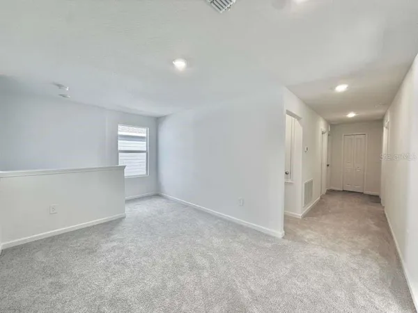 an empty room with windows