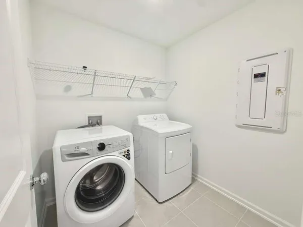 a utility room with dryer and washer
