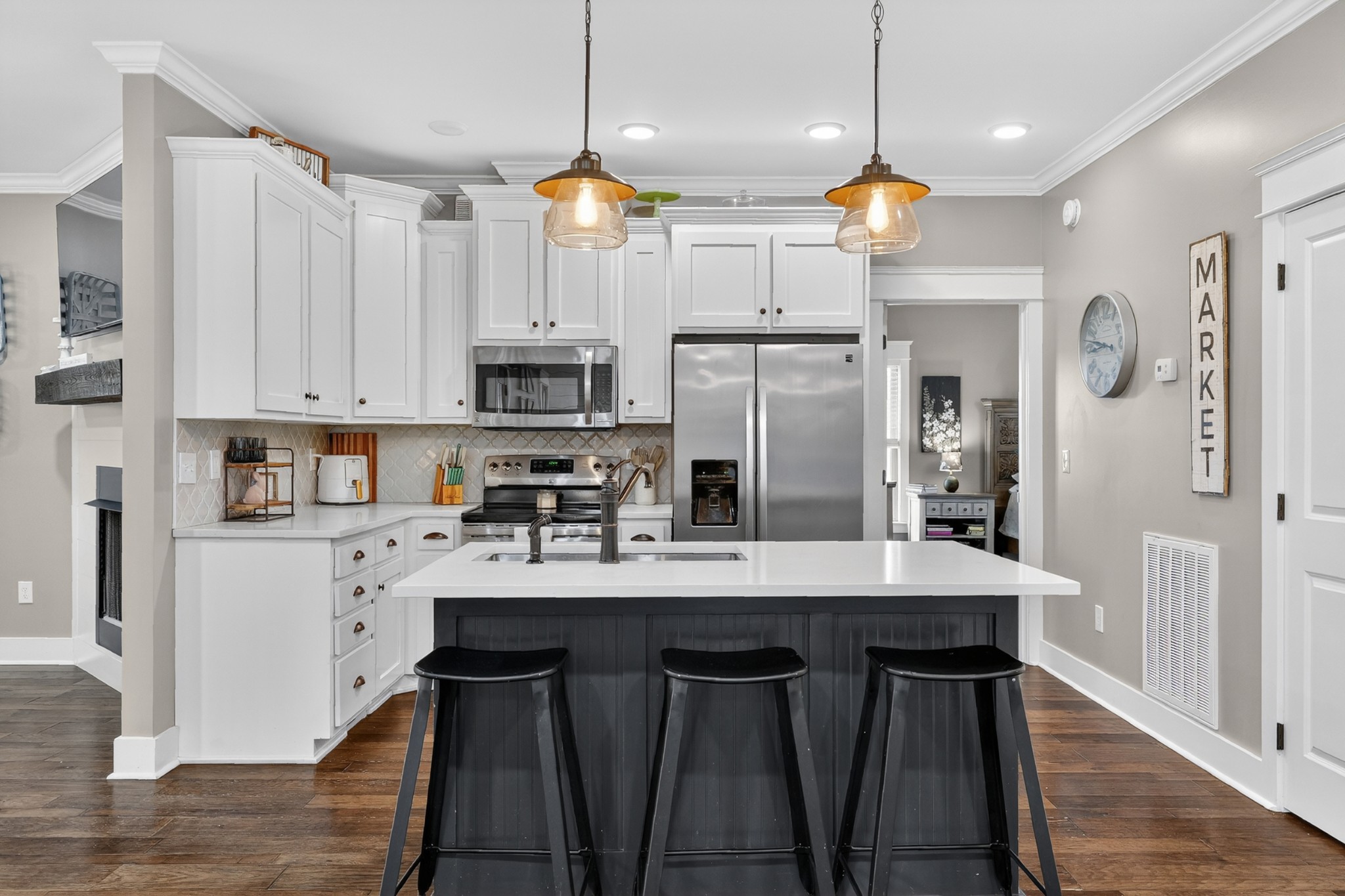39 Boning Road Fayetteville, TN 37334 - Photo 13 of 43 a kitchen with stainless steel appliances granite countertop a refrigerator a sink dishwasher a stove a kitchen island with a dining table and chairs