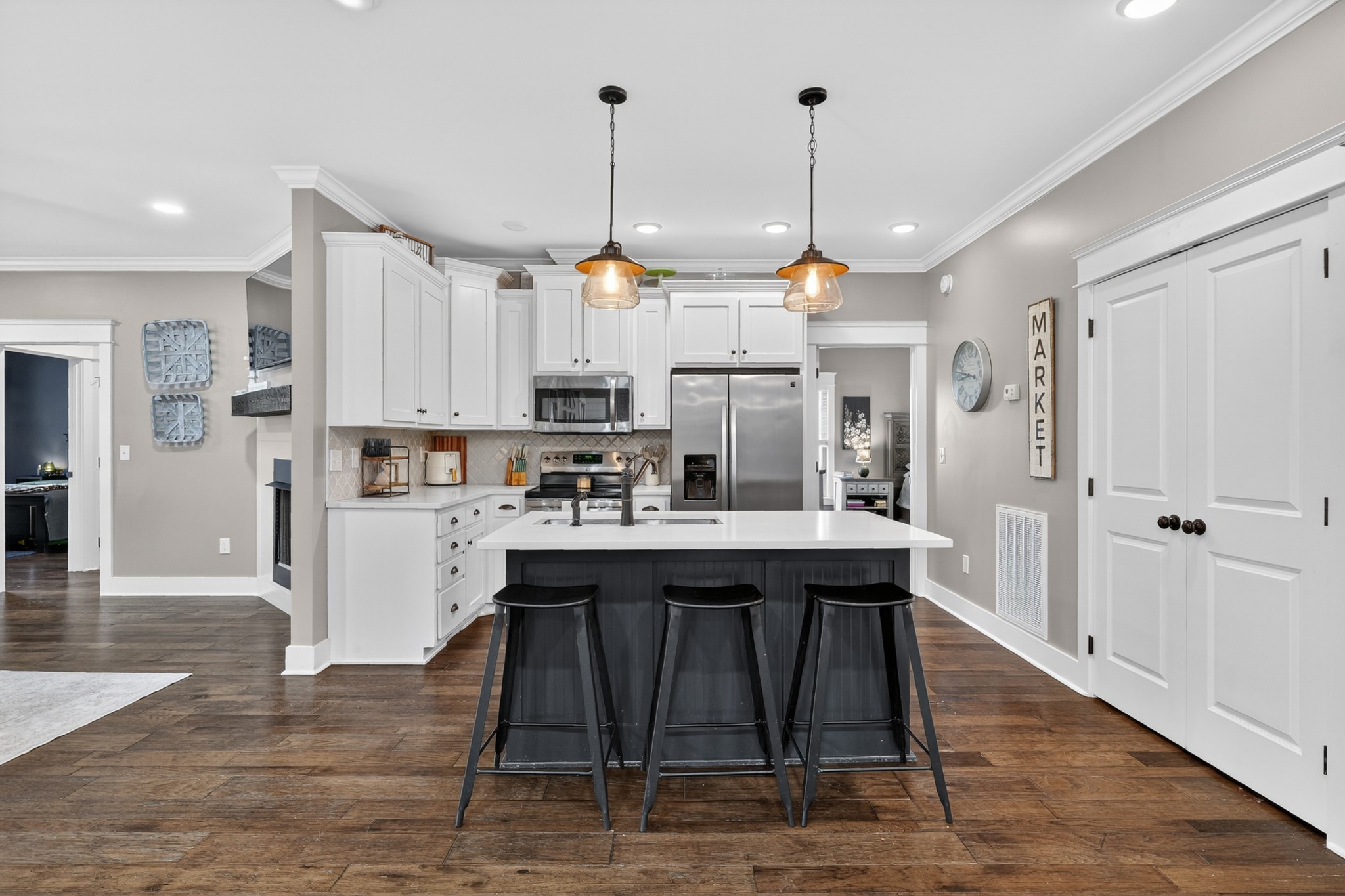 39 Boning Road Fayetteville, TN 37334 - Photo 15 of 43 a kitchen with kitchen island granite countertop a table chairs refrigerator and microwave