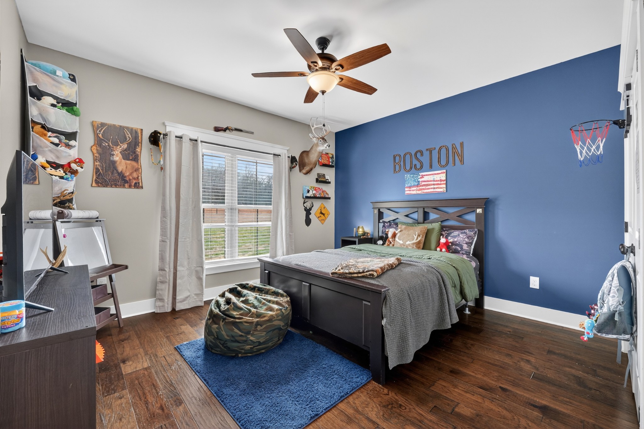 39 Boning Road Fayetteville, TN 37334 - Photo 25 of 43 a bedroom with a bed and wooden floor