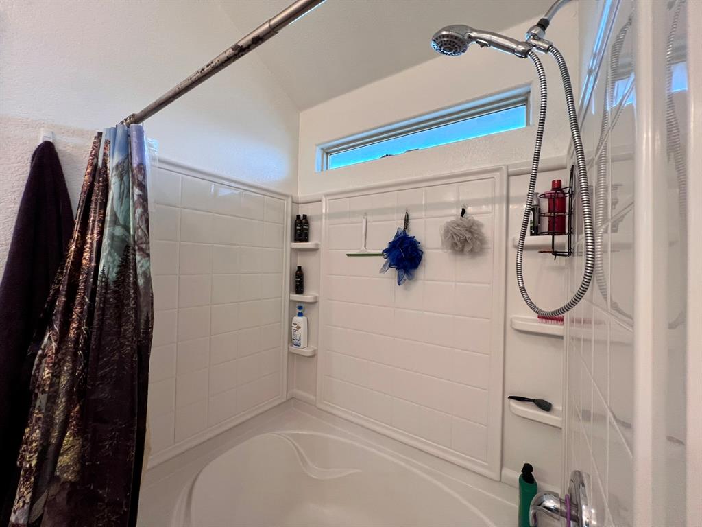 324 Fairgrounds Lane Ponder, TX 76259 - Photo 32 of 40 a bathroom with a shower and a sink