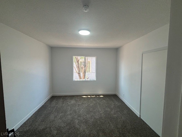 148 Fir Street Henderson, NV 89015 - Photo 10 of 12 Plush wall-to-wall carpeting and a bright central window define this serene bedroom space.