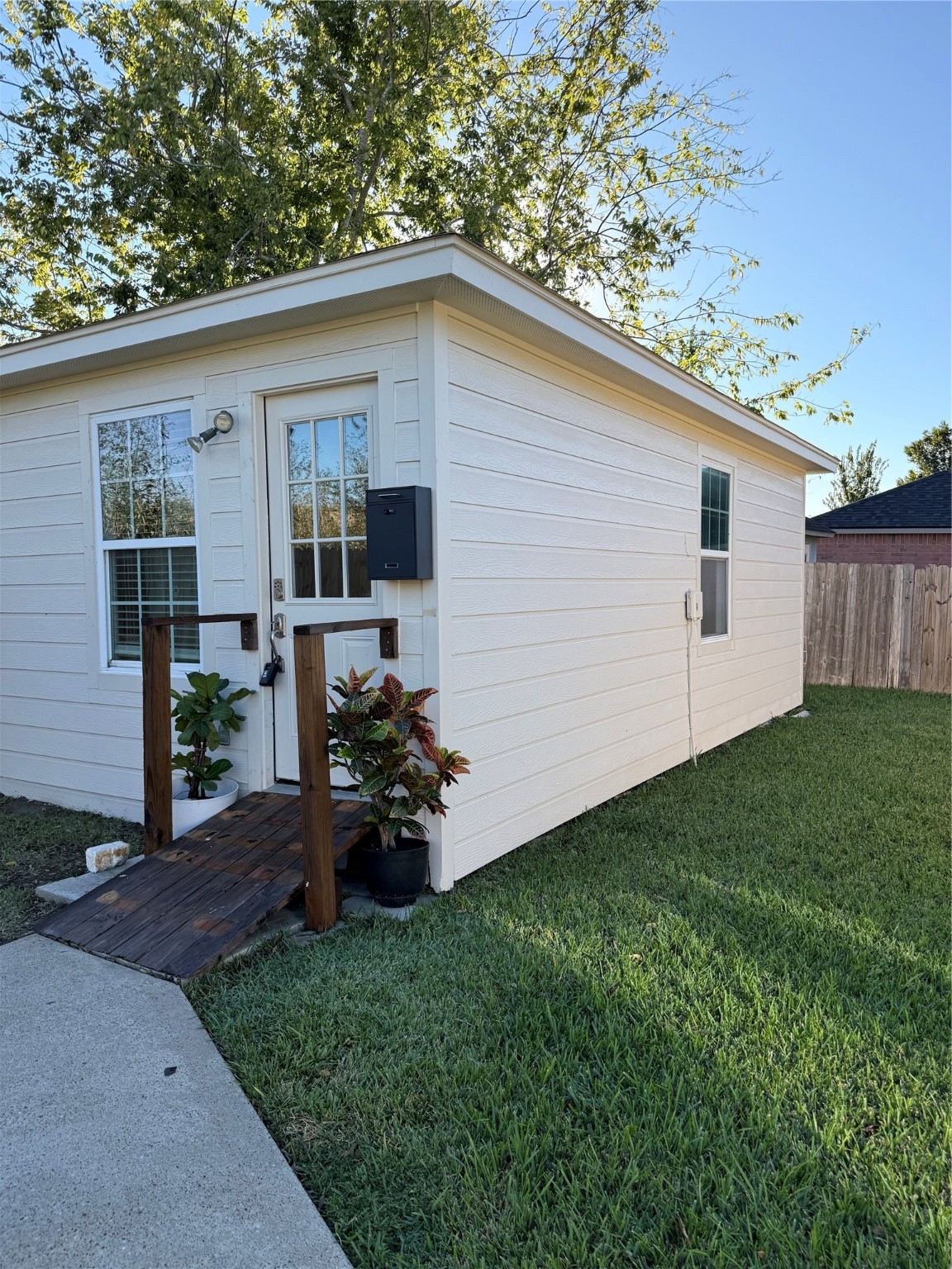 5519 Rio Sabinas Street Rosharon, TX 77583 - Photo 1 of 9 a backyard of a house with wooden fence