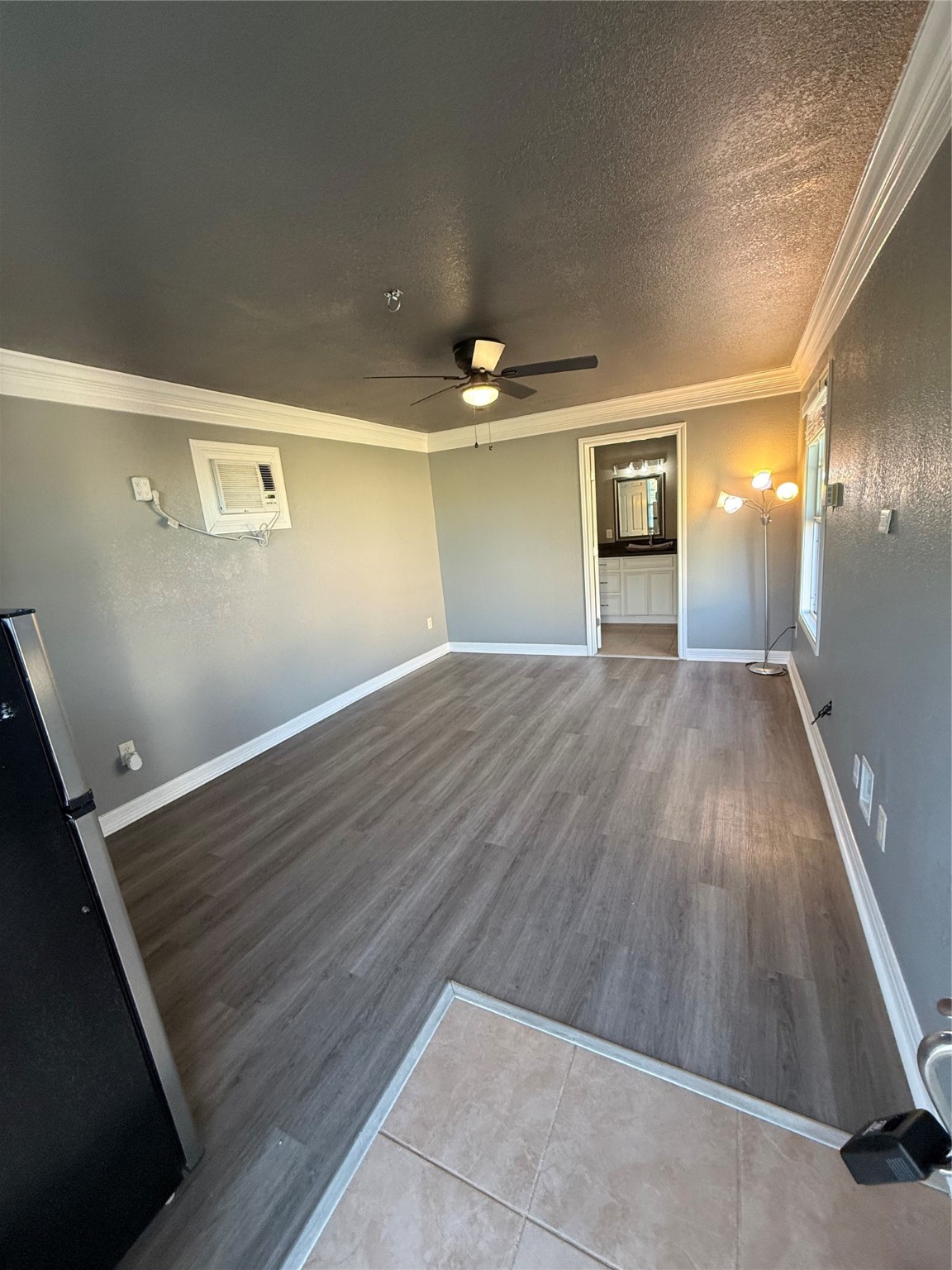5519 Rio Sabinas Street Rosharon, TX 77583 - Photo 6 of 9 a view of a hallway with wooden floor