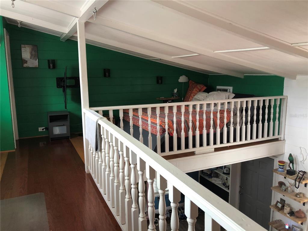 416 Princess Street Clearwater, FL 33755 - Photo 11 of 17 a view of balcony with wooden floor and stairs