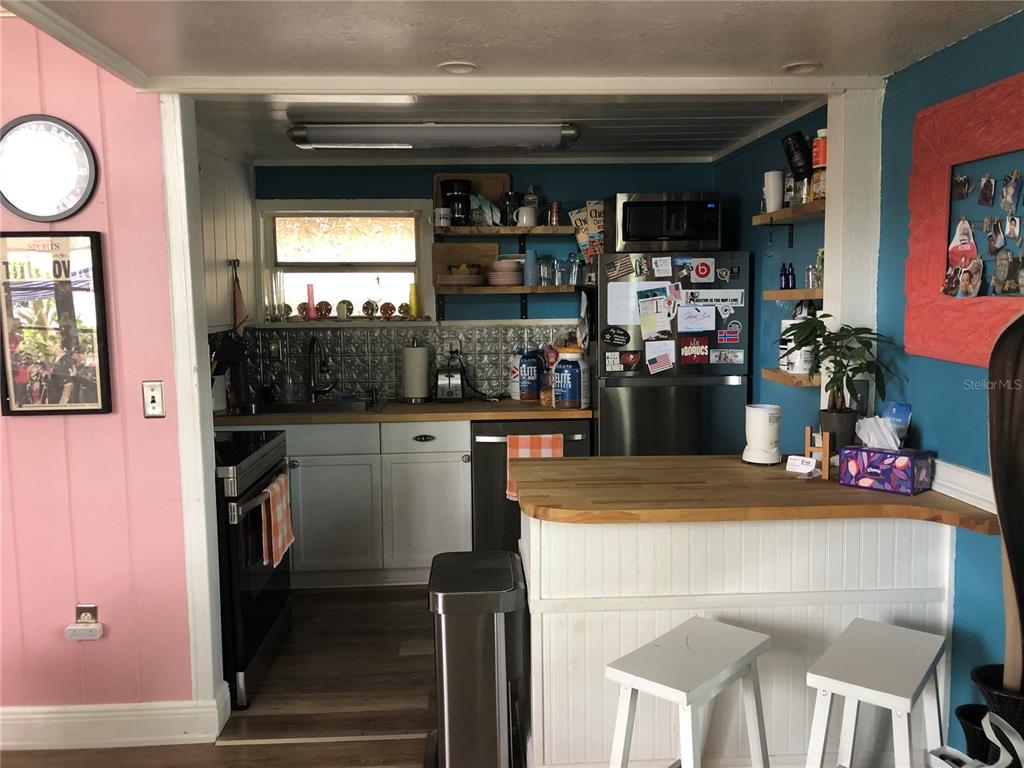416 Princess Street Clearwater, FL 33755 - Photo 5 of 17 a kitchen view of a dining table chairs and entryway