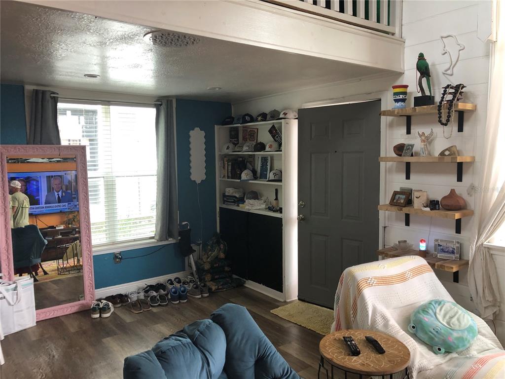 416 Princess Street Clearwater, FL 33755 - Photo 8 of 17 a bedroom with furniture and a window