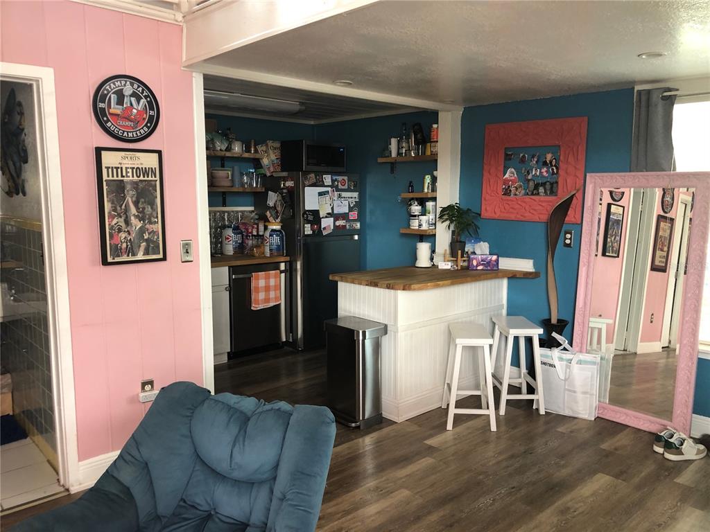 416 Princess Street Clearwater, FL 33755 - Photo 10 of 17 a dining room with furniture and wooden floor