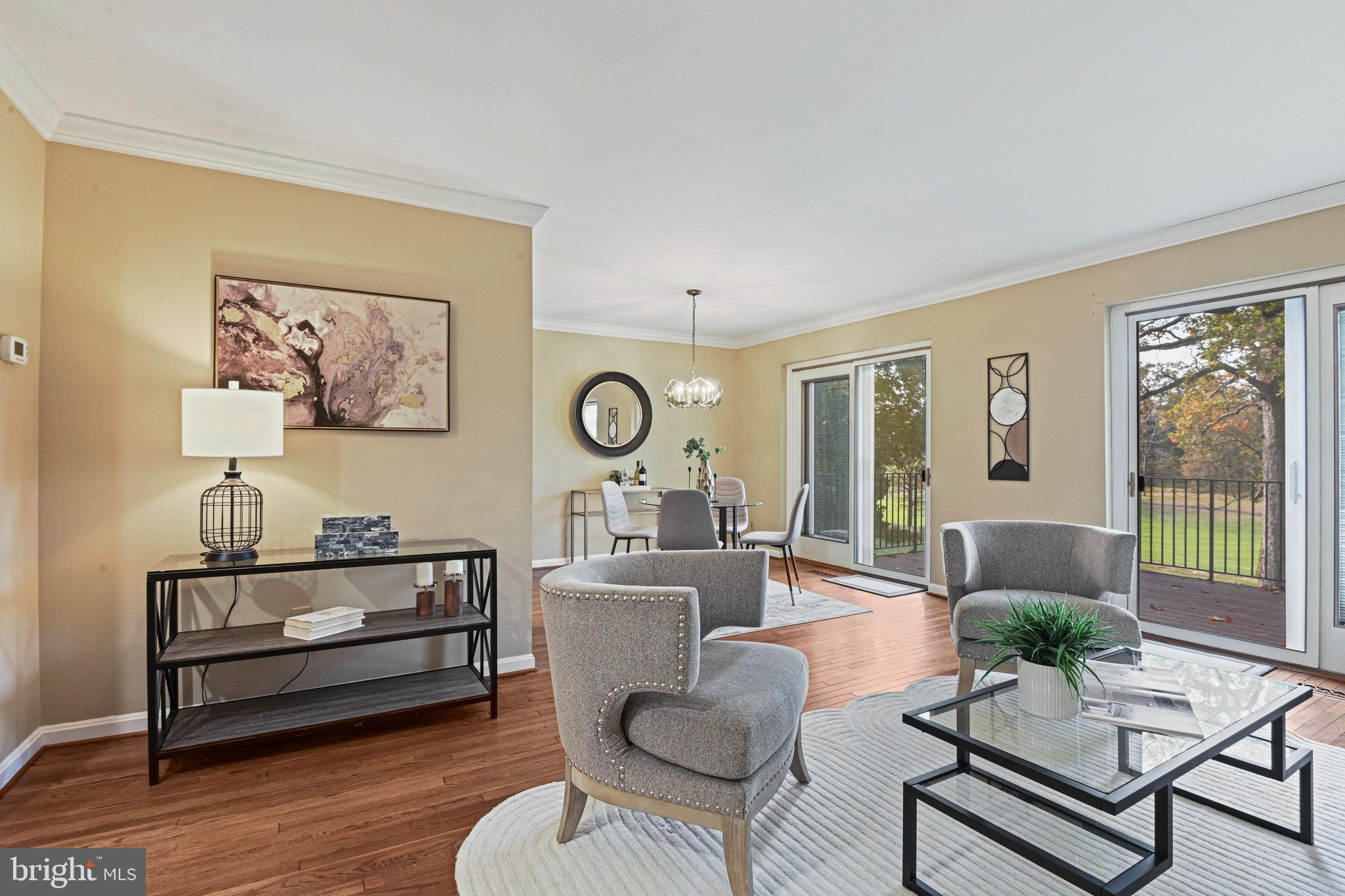 2180 Golf Course Drive Reston, VA 20191 - Photo 12 of 40 a living room with furniture and a large window