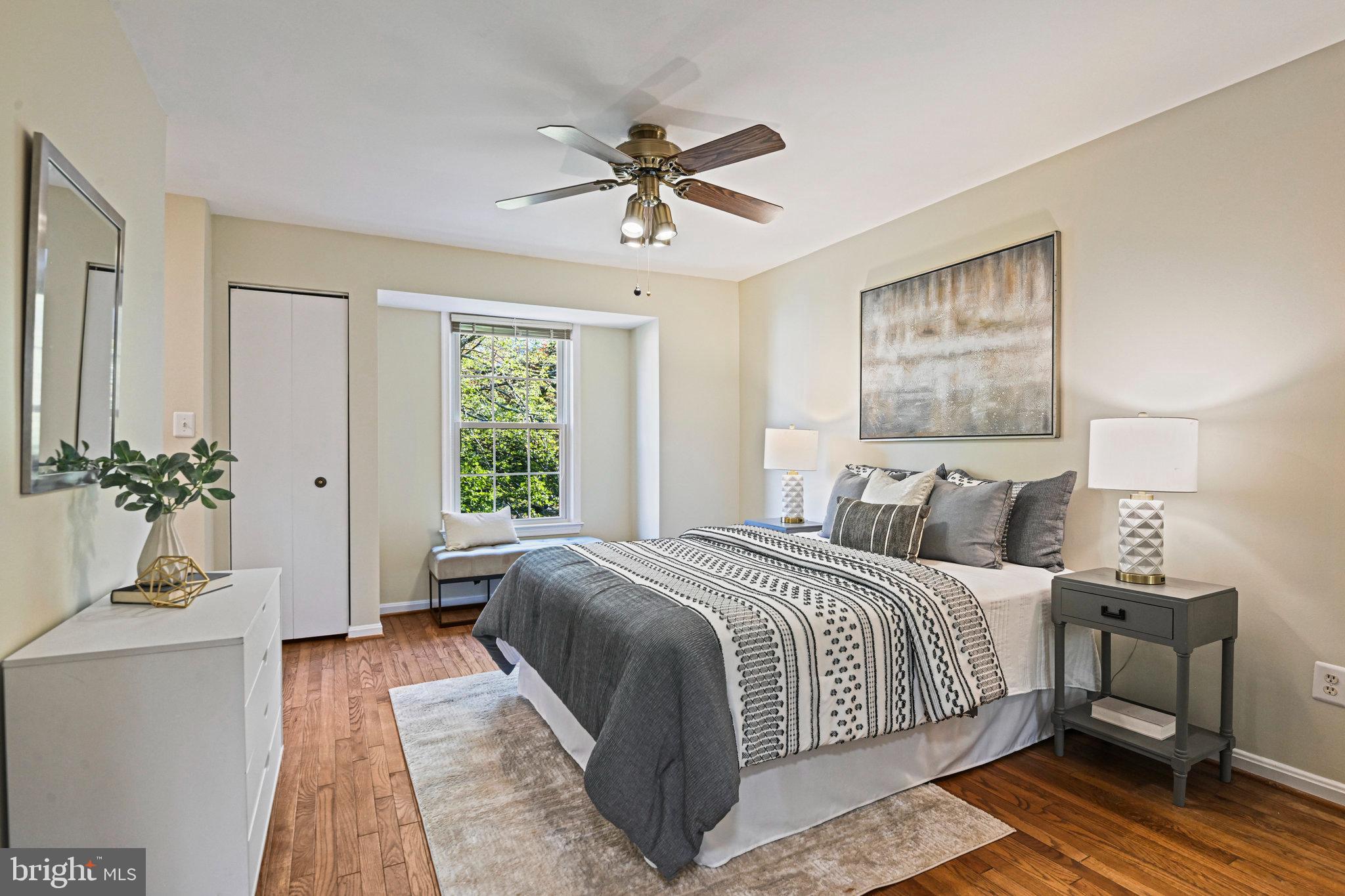 2180 Golf Course Drive Reston, VA 20191 - Photo 17 of 40 a bedroom with a large bed and a chandelier