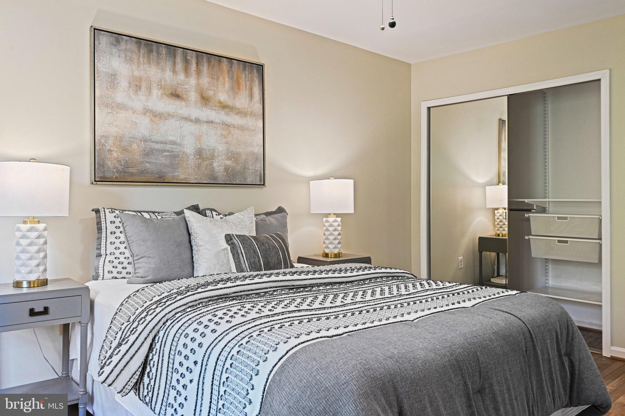 2180 Golf Course Drive Reston, VA 20191 - Photo 18 of 40 a bedroom with a bed and a painting on the wall