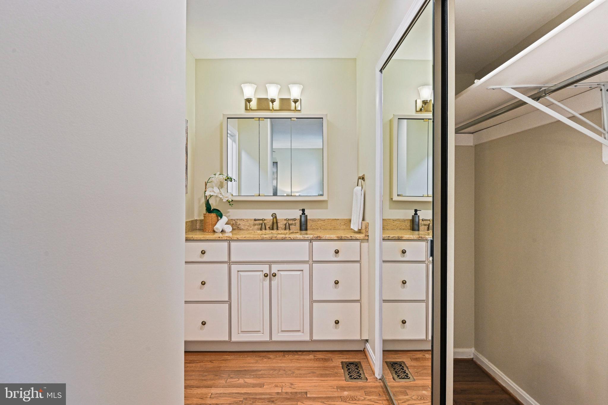 2180 Golf Course Drive Reston, VA 20191 - Photo 20 of 40 a bathroom with a sink a mirror and a shower
