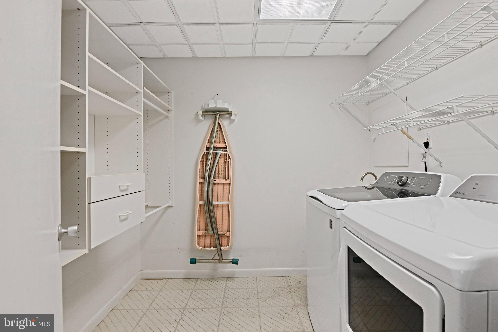 2180 Golf Course Drive Reston, VA 20191 - Photo 29 of 40 a view of storage and utility room with washer and dryer