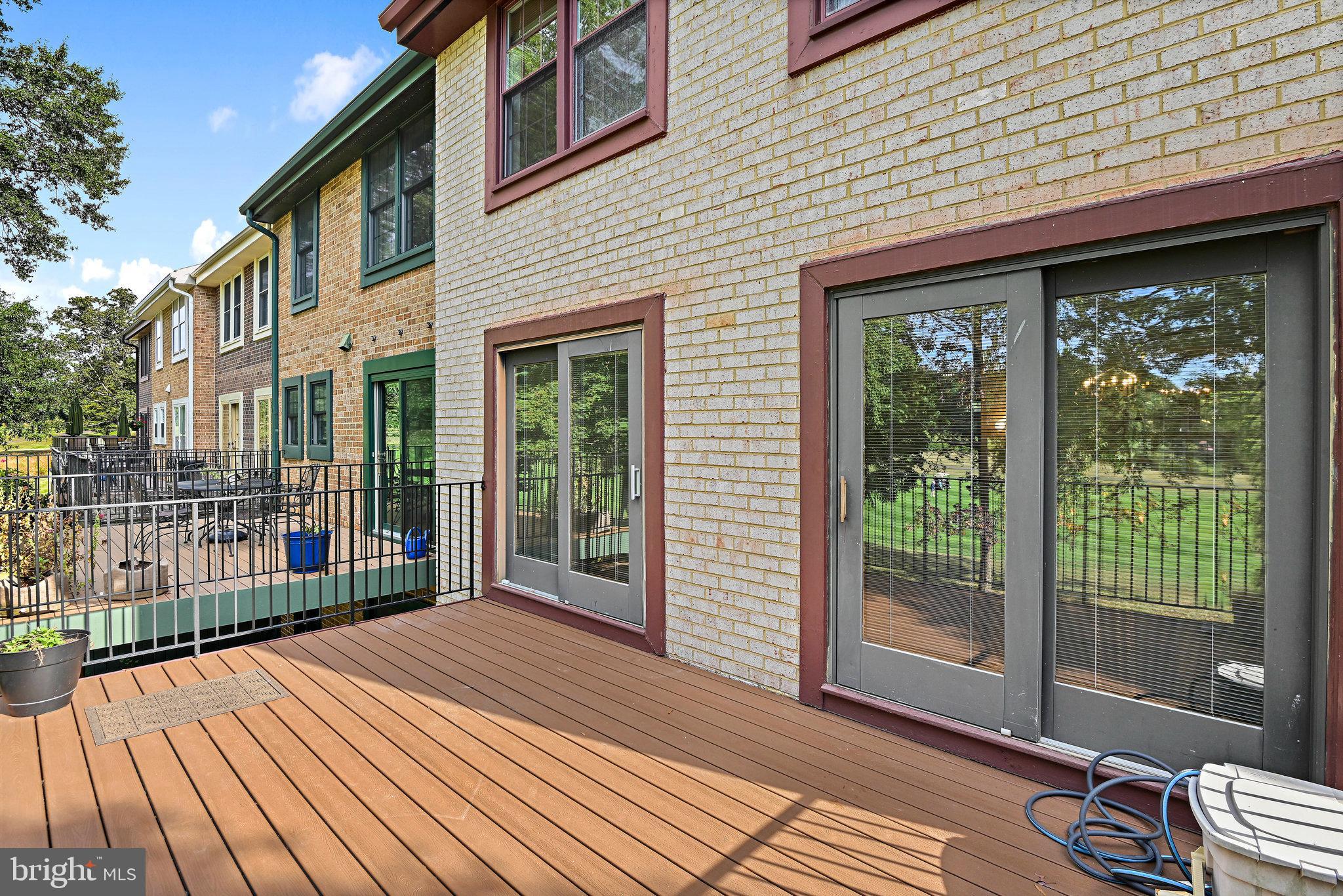 2180 Golf Course Drive Reston, VA 20191 - Photo 39 of 40 a view of a house with wooden floor and floor to ceiling window