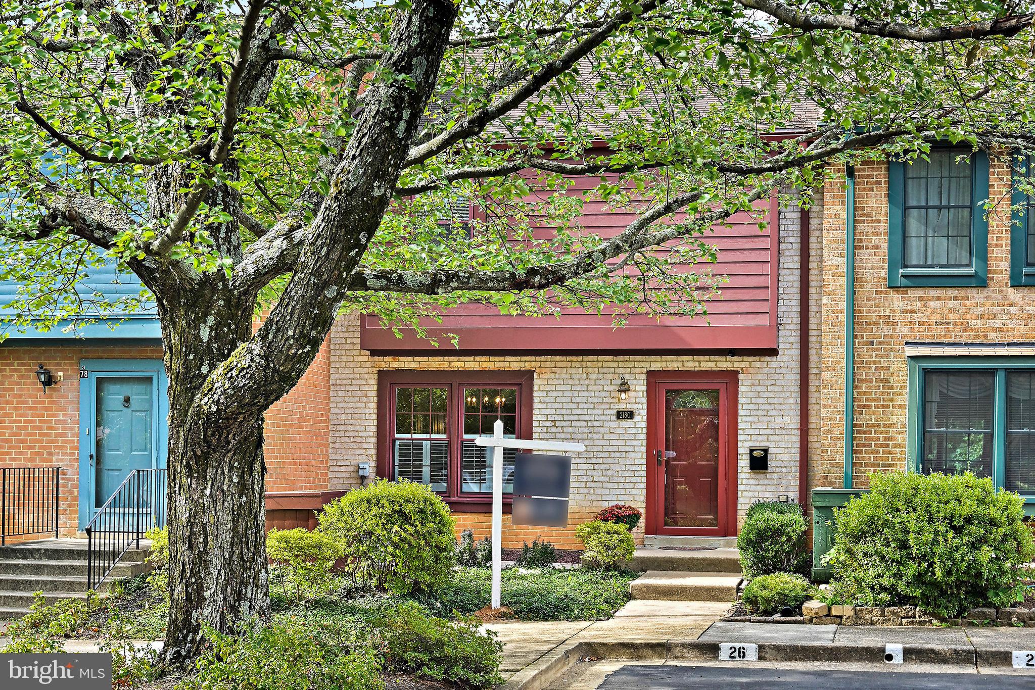 2180 Golf Course Drive Reston, VA 20191 - Photo 4 of 40 front view of a house with a tree
