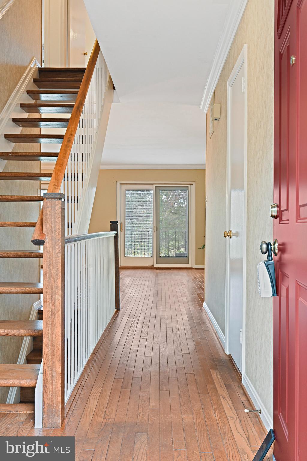 2180 Golf Course Drive Reston, VA 20191 - Photo 6 of 40 a view of a hallway with wooden floor and entryway