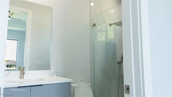 a bathroom with a sink and mirror