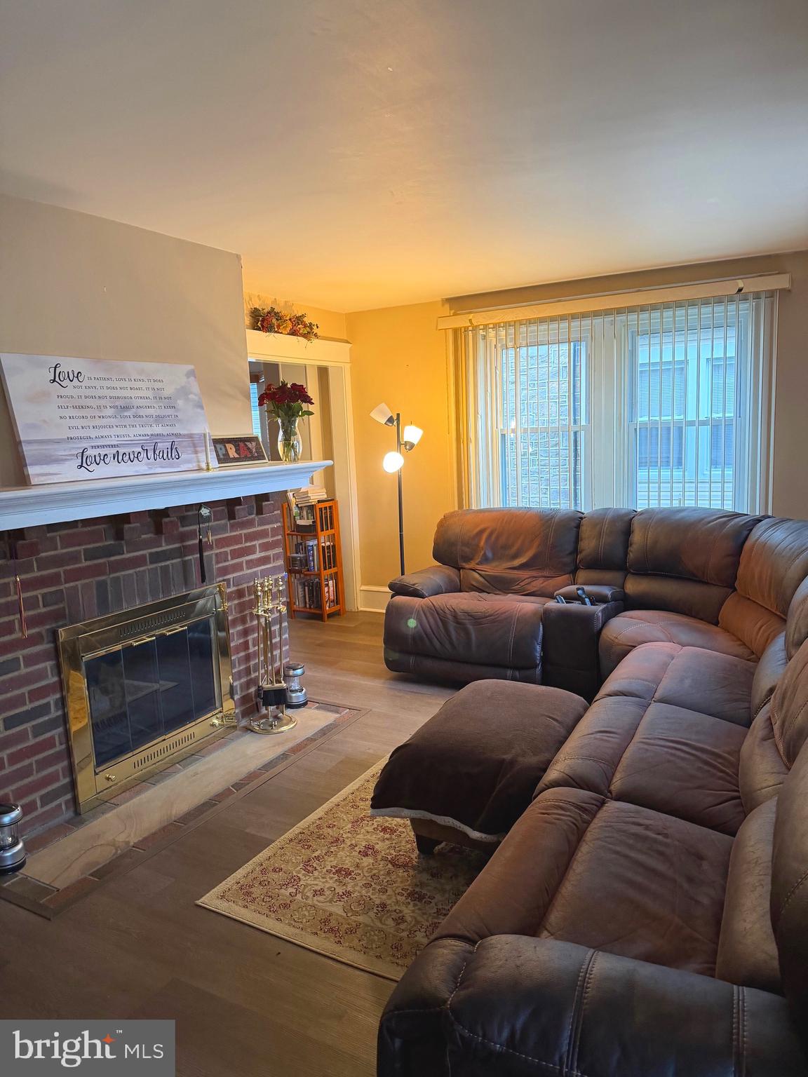 463 Burmont Road Drexel Hill, PA 19026 - Photo 8 of 39 a living room with furniture a fireplace and a large window
