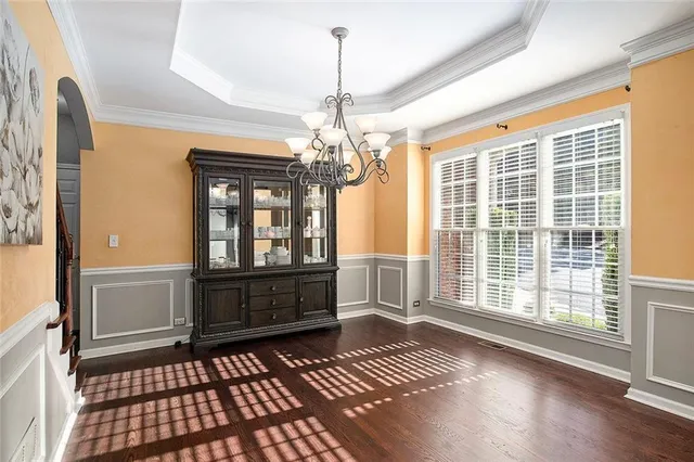 a bedroom with furniture and flat screen tv