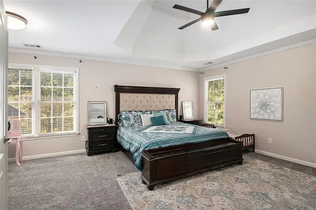 a bathroom with a tub a sink shower and mirror