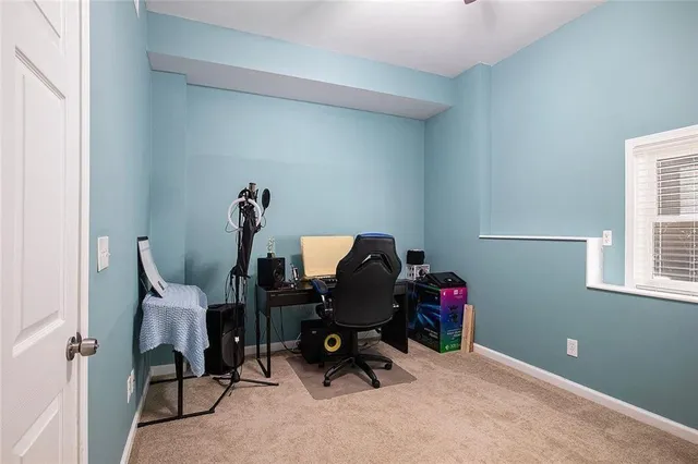a large bedroom with closet and cabinet