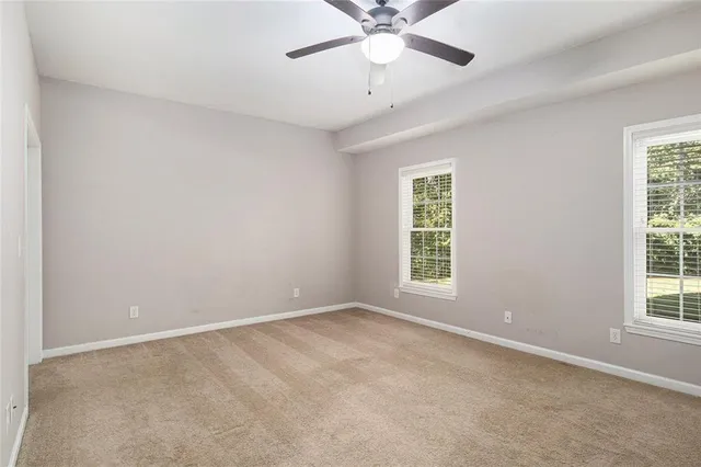 a large kitchen with cabinets and stainless steel appliances