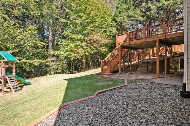 a view of a house with a yard and plants