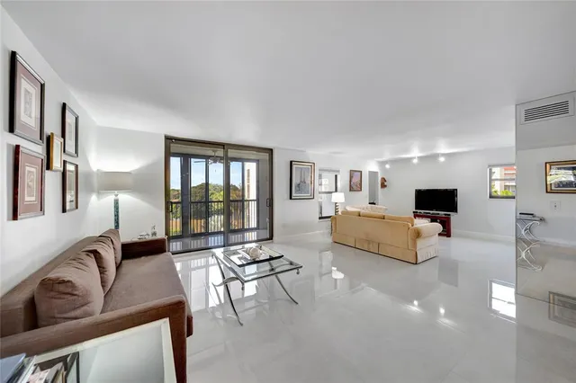 a white toilet sitting next to a shower