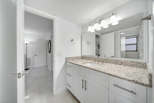 a view of a swimming pool with a lounge chair