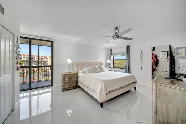 a view of a patio with a table and chairs under an umbrella