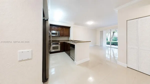 a view of a kitchen with a sink