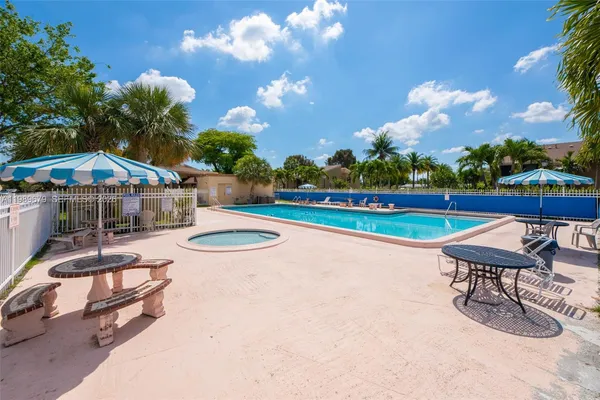 a view of a swimming pool with lounge chairs