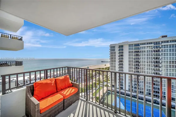 a view of balcony with furniture